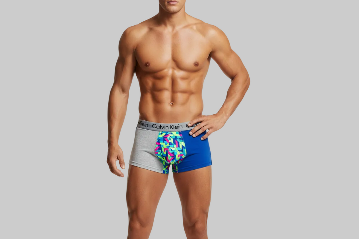 Calvin Klein Boys Underwear | 4-Pack Boxer Brief | Heather Grey/Blue/Neon Print | X-Small wearing the men